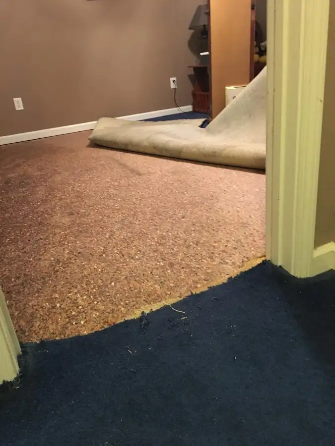 Carpet pad removal revealing water damage during Drying & Dehumidification in Clear Lake
